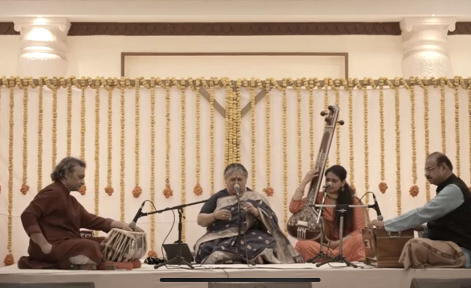 A musical performance featuring, from left to right, Aneesh Pradhan on the tabla, Shubha Mudgal on vocals, Pooja Vazirani on the tanpura, and Sudhir Nayak on the harmonium.